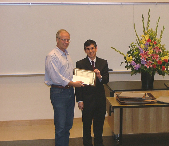 Photo of Bruce Nelson receiving the Teaching Excellence Award.