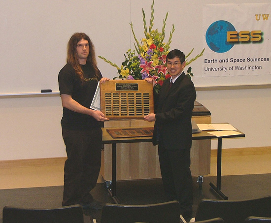 Photo of Elias Bloch receiving the top undergraduate Merrill Prize.