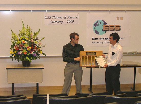 Photo of Ryan Erickson receiving the top undergraduate Merrill Prize.